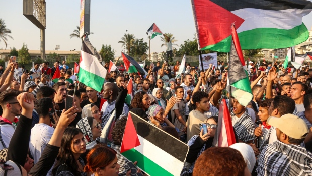 protesters-wave-palestinian-flags-during-a-pro-palestinian-demonstration-on-el-nasr-road-in-the-nasr-city-district-of-cairo-egypt-on-friday-oct-20-2023