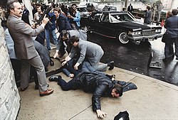 Photograph_of_chaos_outside_the_Washington_Hilton_Hotel_after_the_assassination_attempt_on_President_Reagan_(white_border_removed)