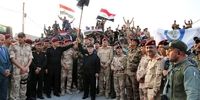 لحظه بالا بردن پرچم عراق و اعلام رسمی آزادسازی موصل + عکس