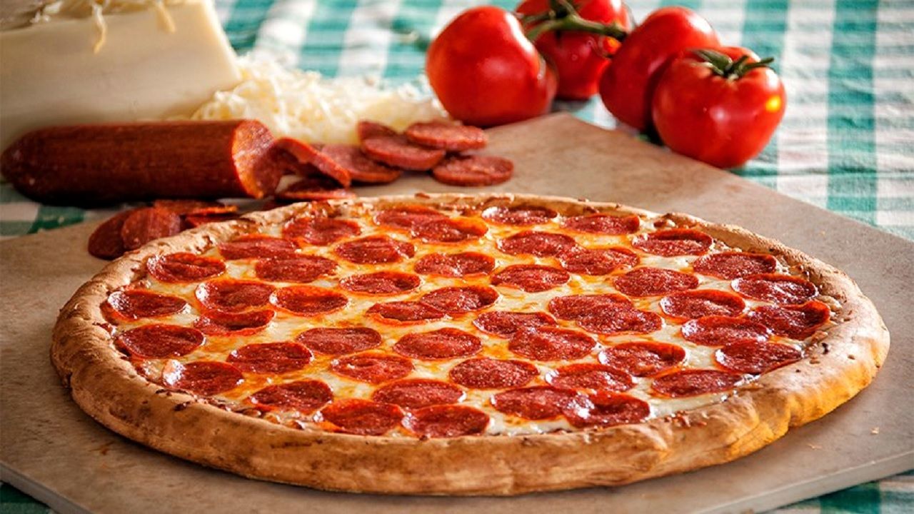بلایی که با خوردن پیتزا سر بدنتان می آورید 